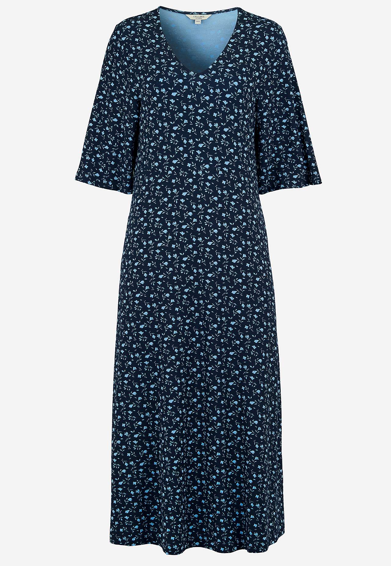 Jerseykjole med et blomstermønster og lommer Jerseykjole med et blomstermønster og lommer